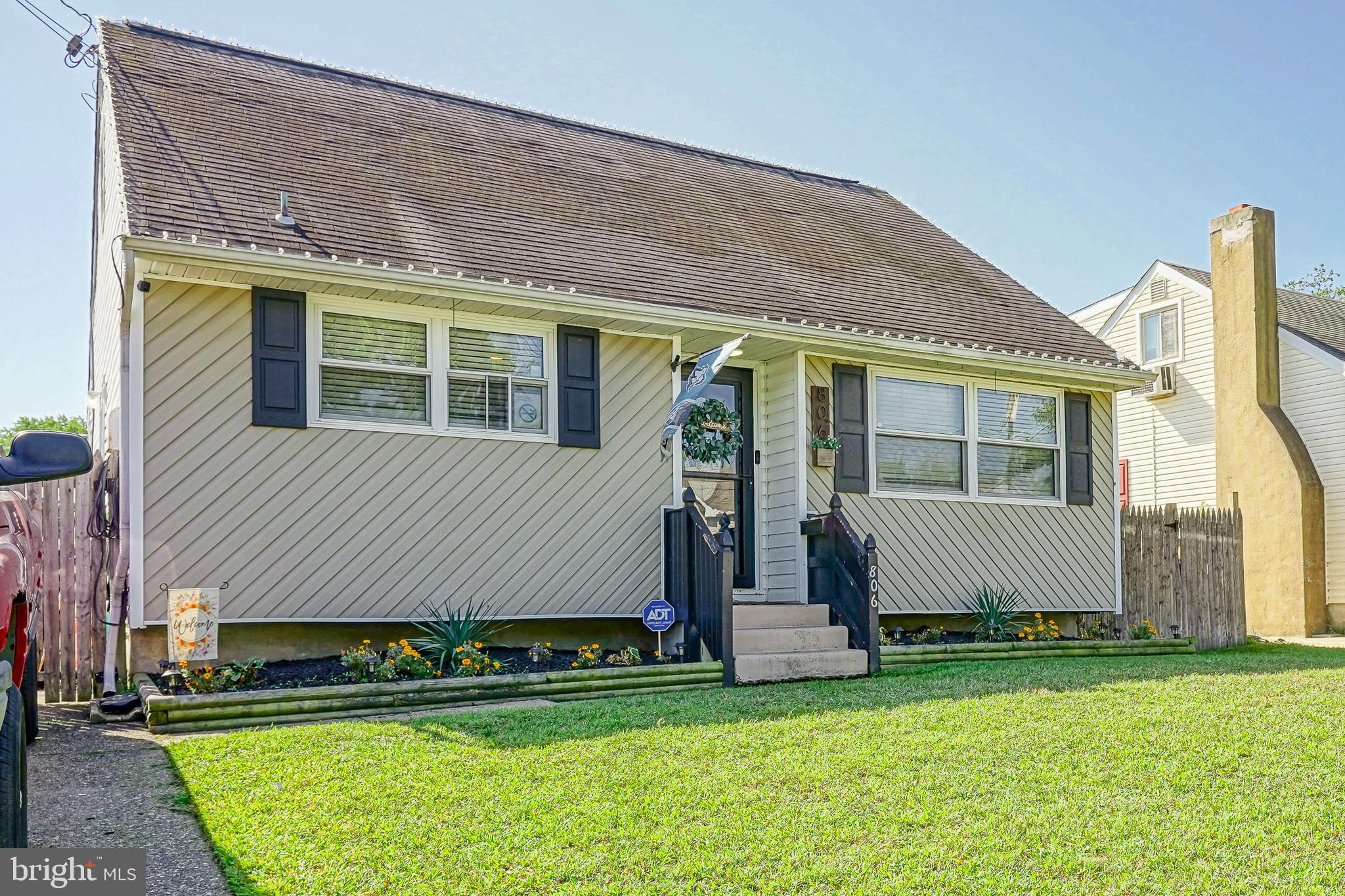 806 West Evesham Road Glendora, NJ 08029 - Photo 26 of 26 a front view of a house with a garden and deck