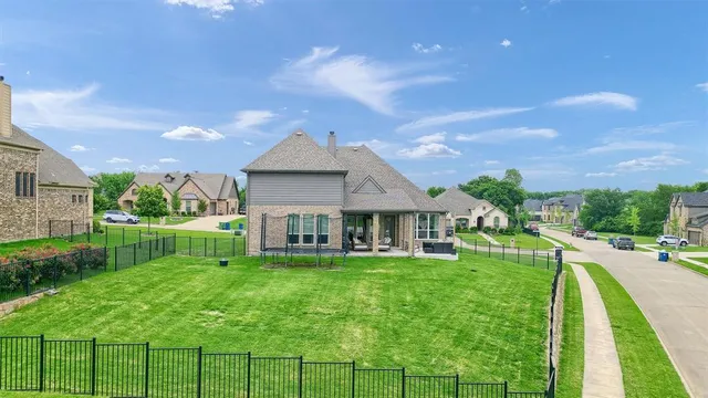 a front view of a house with a yard table and chairs