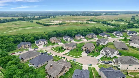 a view of a city with lawn chairs