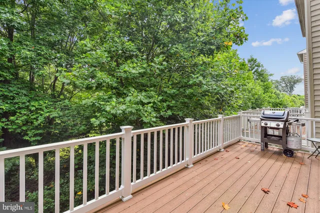a balcony with wooden floor and outdoor space