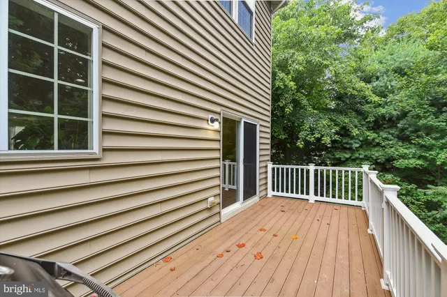 a view of backyard with a deck