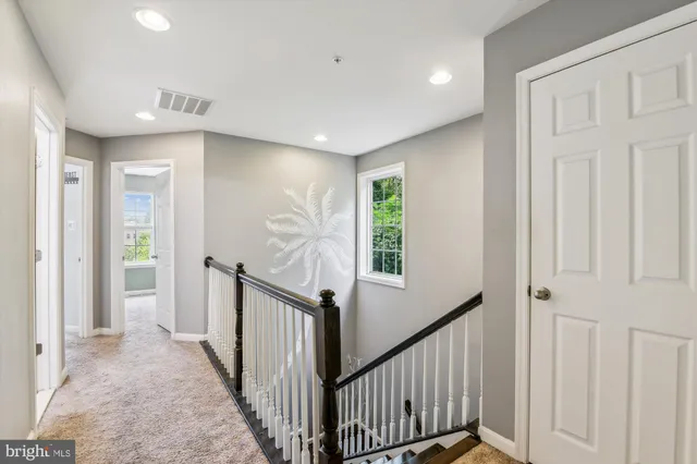 a view of a hallway with windows