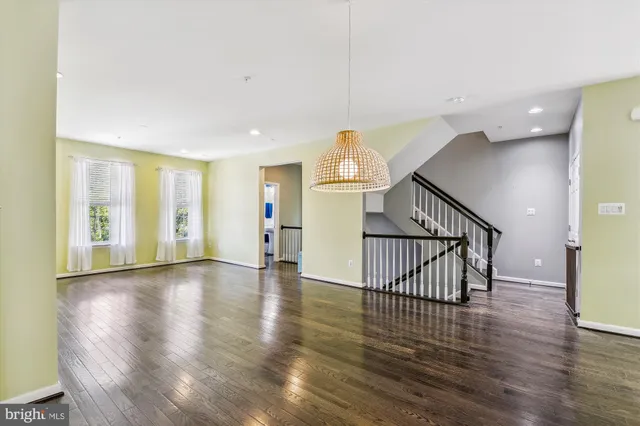 a view of an entryway with wooden floor