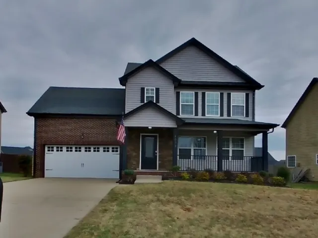 front view of a house with a yard