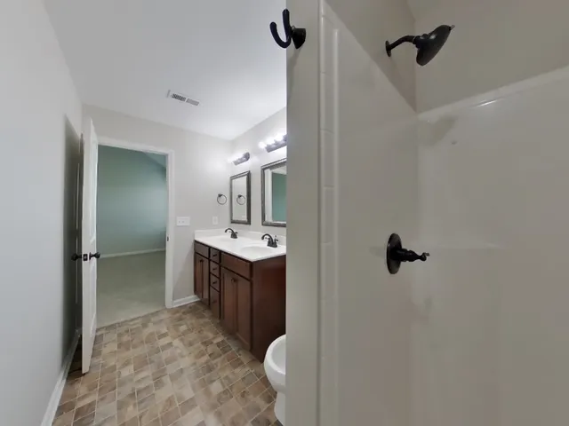 a bathroom with a sink and mirror
