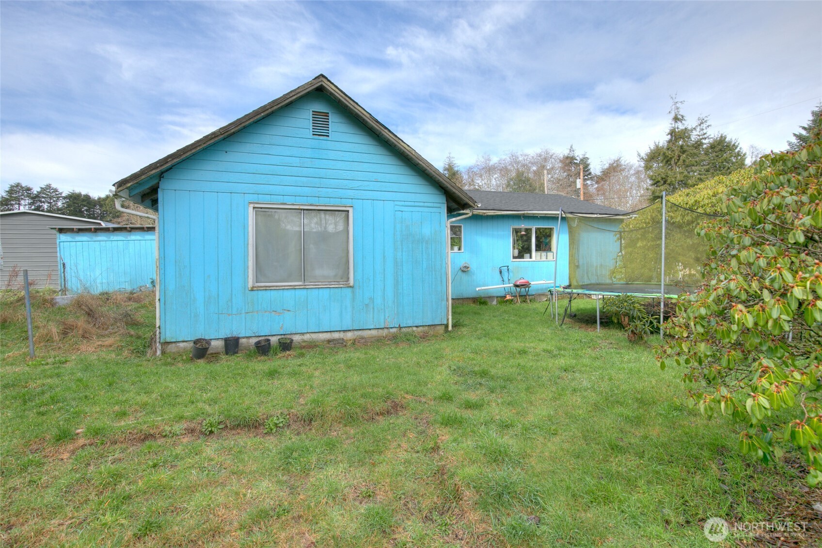 102 Elma Street Copalis Beach, WA 98535 - Photo 23 of 23 a view of a backyard with plants and a garden