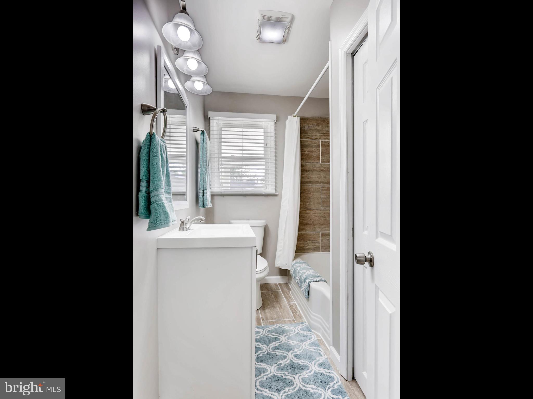 7 Forest Road Middle River, MD 21220 - Photo 13 of 27 a bathroom with a sink toilet and shower