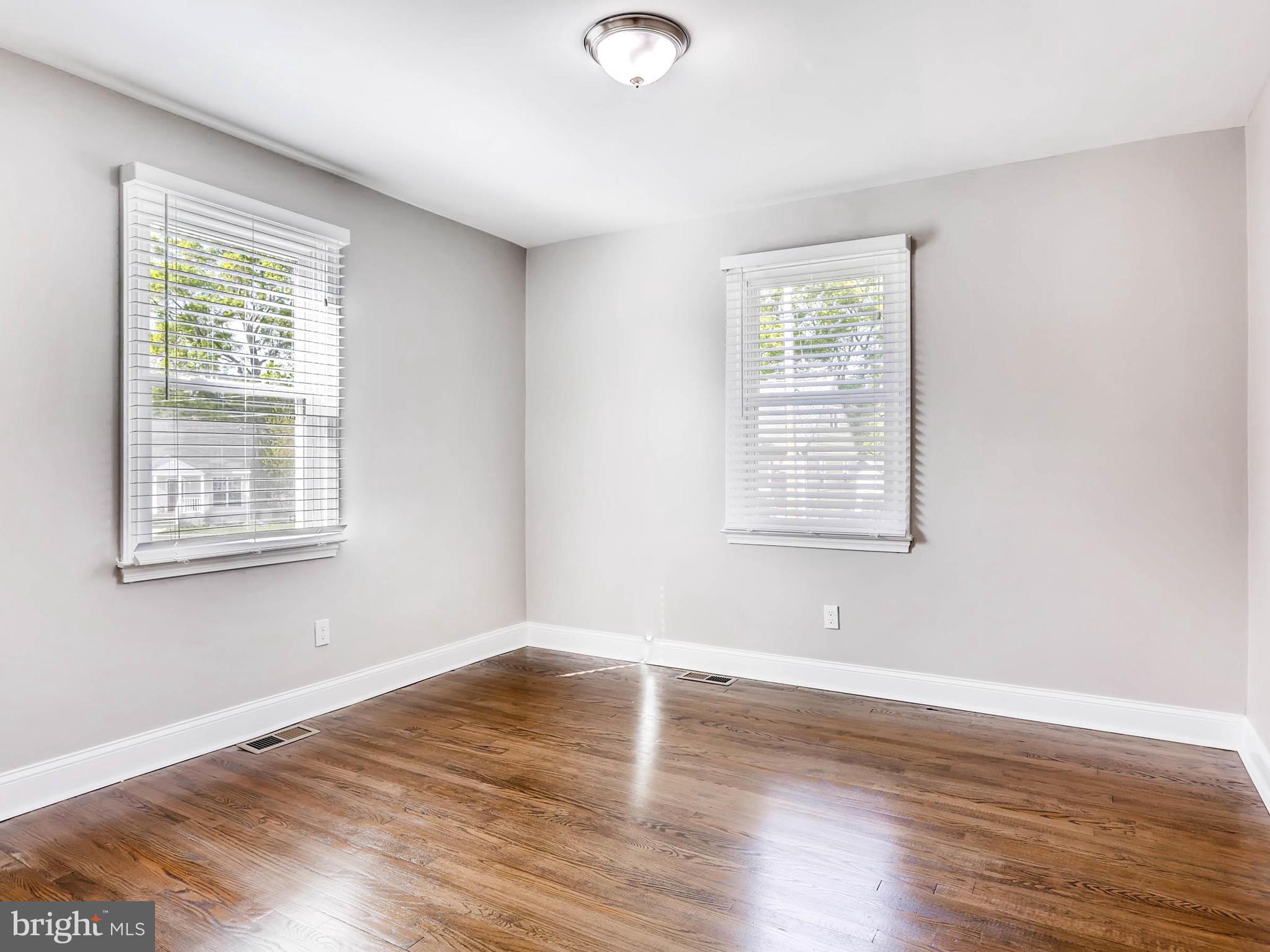 7 Forest Road Middle River, MD 21220 - Photo 8 of 27 a view of empty room with wooden floor and fan