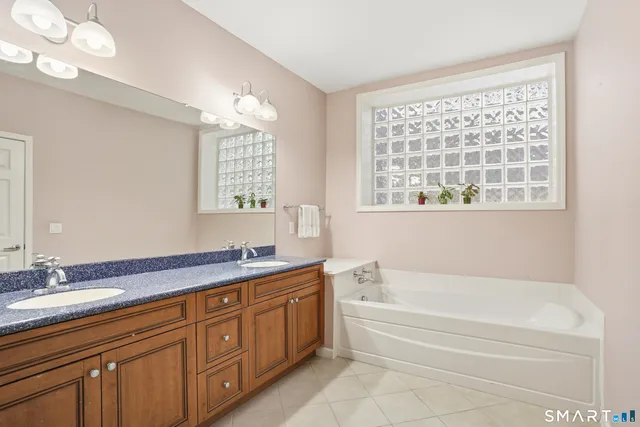 a bath room with a sink and a bathtub