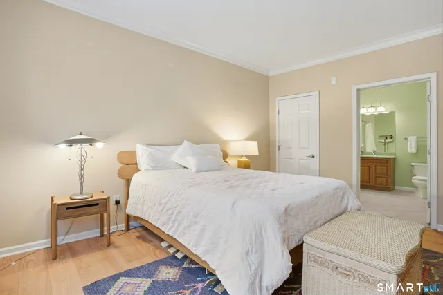 a bedroom with a bed and a table