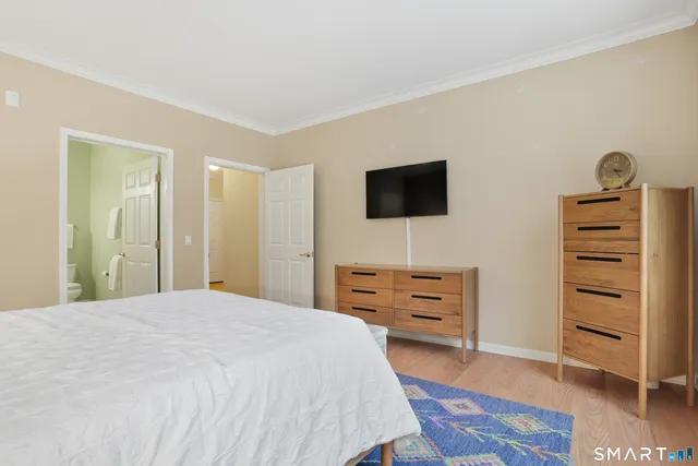 a bedroom with a bed and furniture