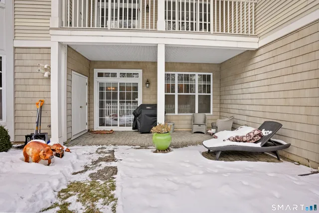 a view of a lounge chair in front of house