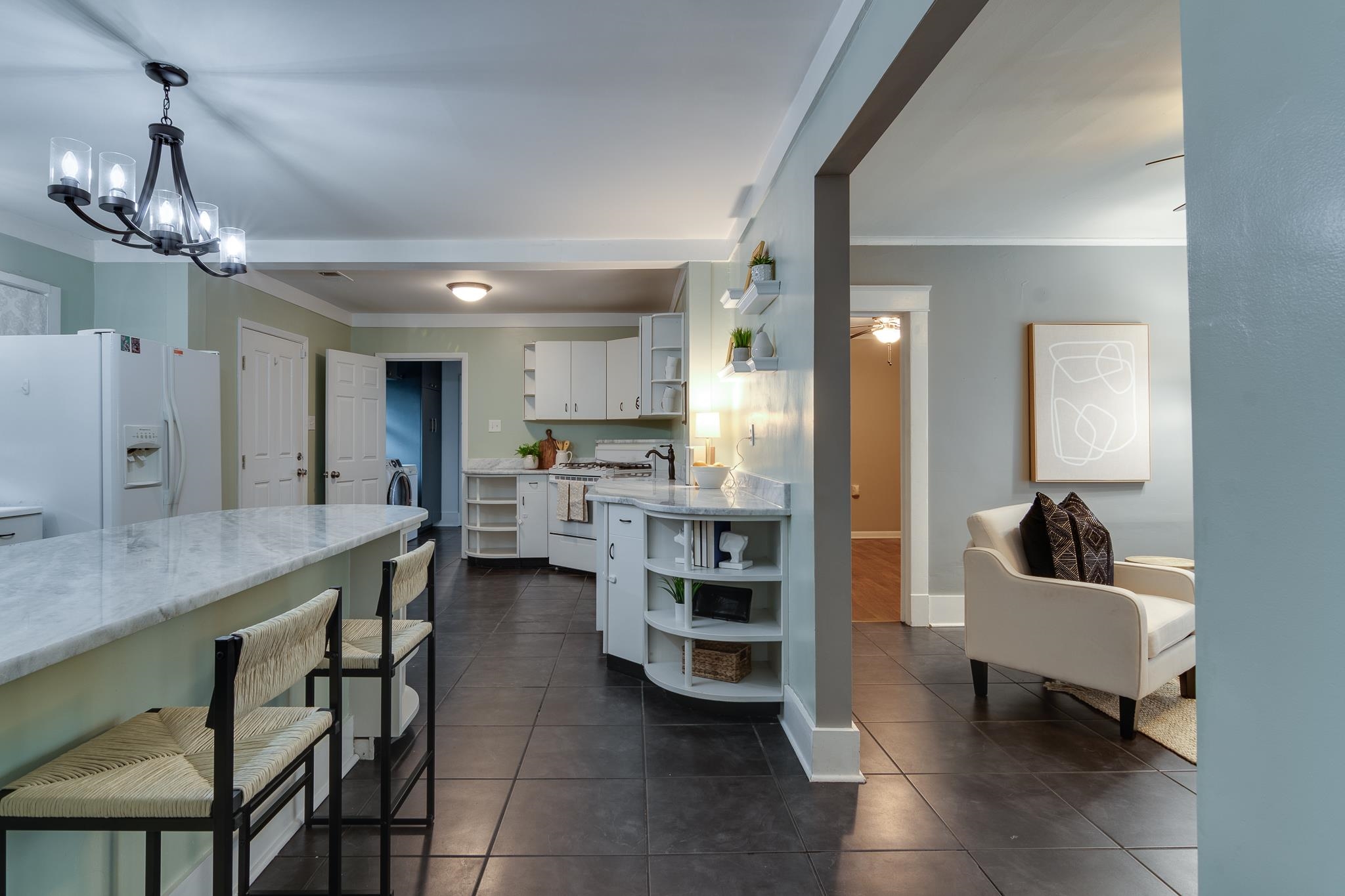 524 Alexander Street Memphis, TN 38111 - Photo 11 of 34 Kitchen with decorative light fixtures, white cabinets, white appliances, and ornamental molding