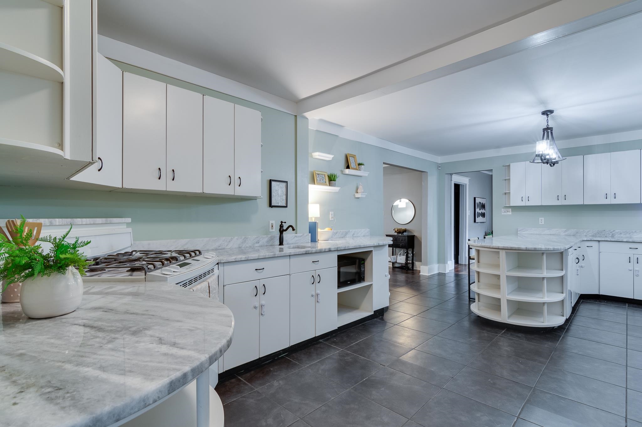 524 Alexander Street Memphis, TN 38111 - Photo 15 of 34 Kitchen with decorative light fixtures, kitchen peninsula, and white cabinetry