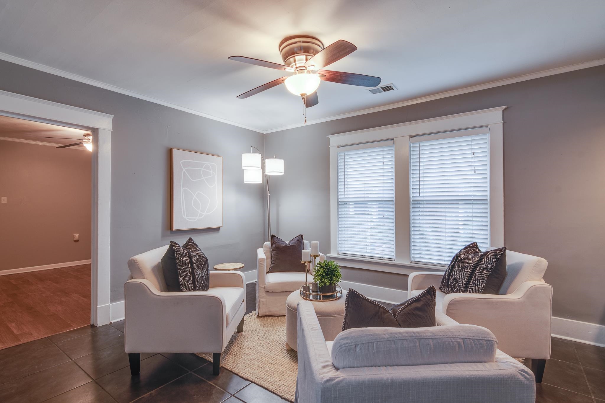 524 Alexander Street Memphis, TN 38111 - Photo 17 of 34 Living room featuring ceiling fan, ornamental molding, and dark tile patterned flooring