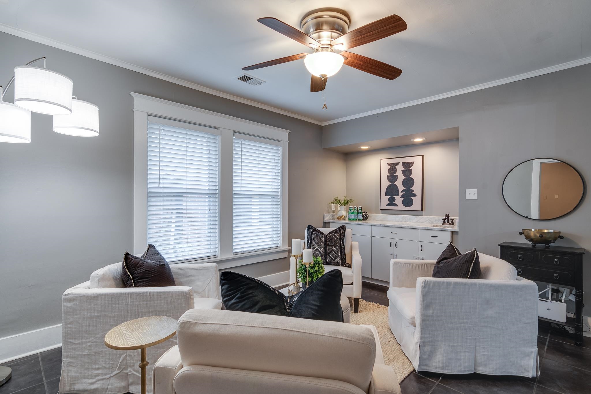 524 Alexander Street Memphis, TN 38111 - Photo 18 of 34 Living room featuring crown molding, dark tile patterned flooring, and ceiling fan