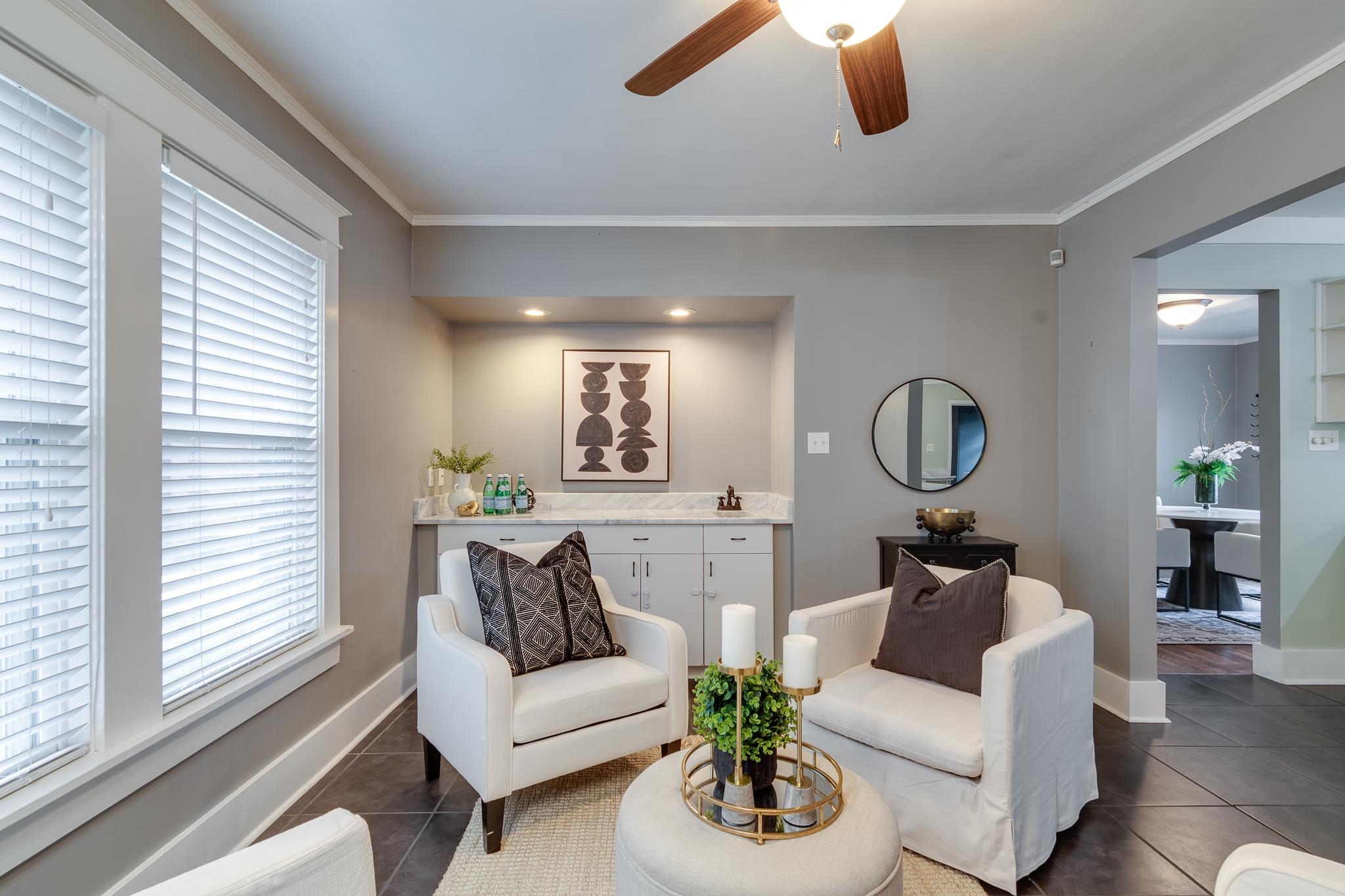 524 Alexander Street Memphis, TN 38111 - Photo 20 of 34 Living room with crown molding, a healthy amount of sunlight, and dark tile patterned flooring