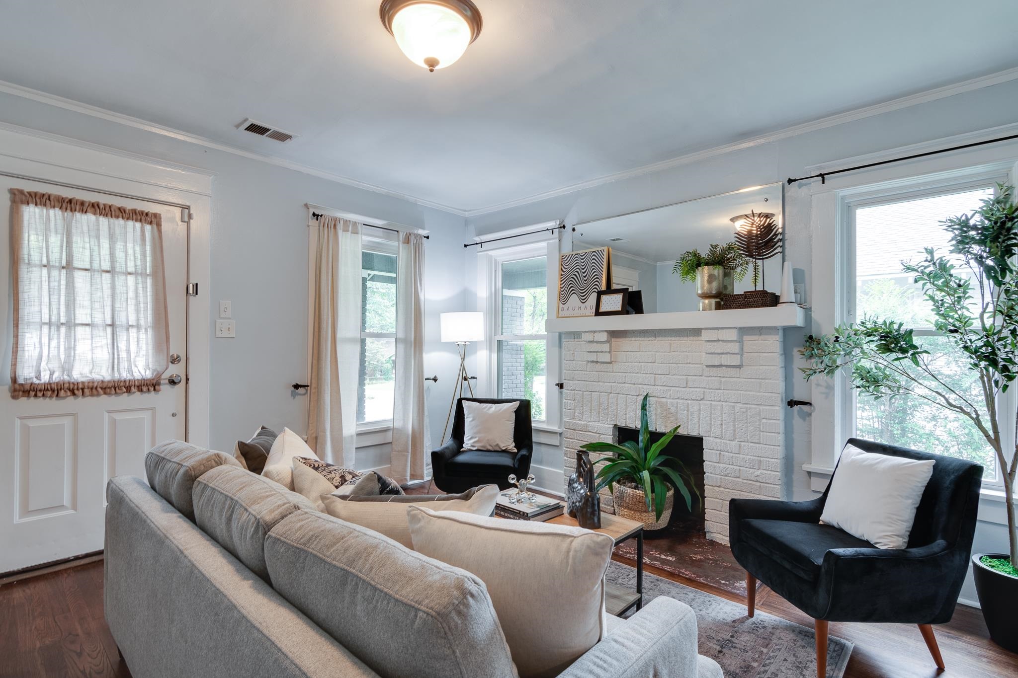 524 Alexander Street Memphis, TN 38111 - Photo 7 of 34 Living room with hardwood / wood-style floors, a fireplace, and plenty of natural light