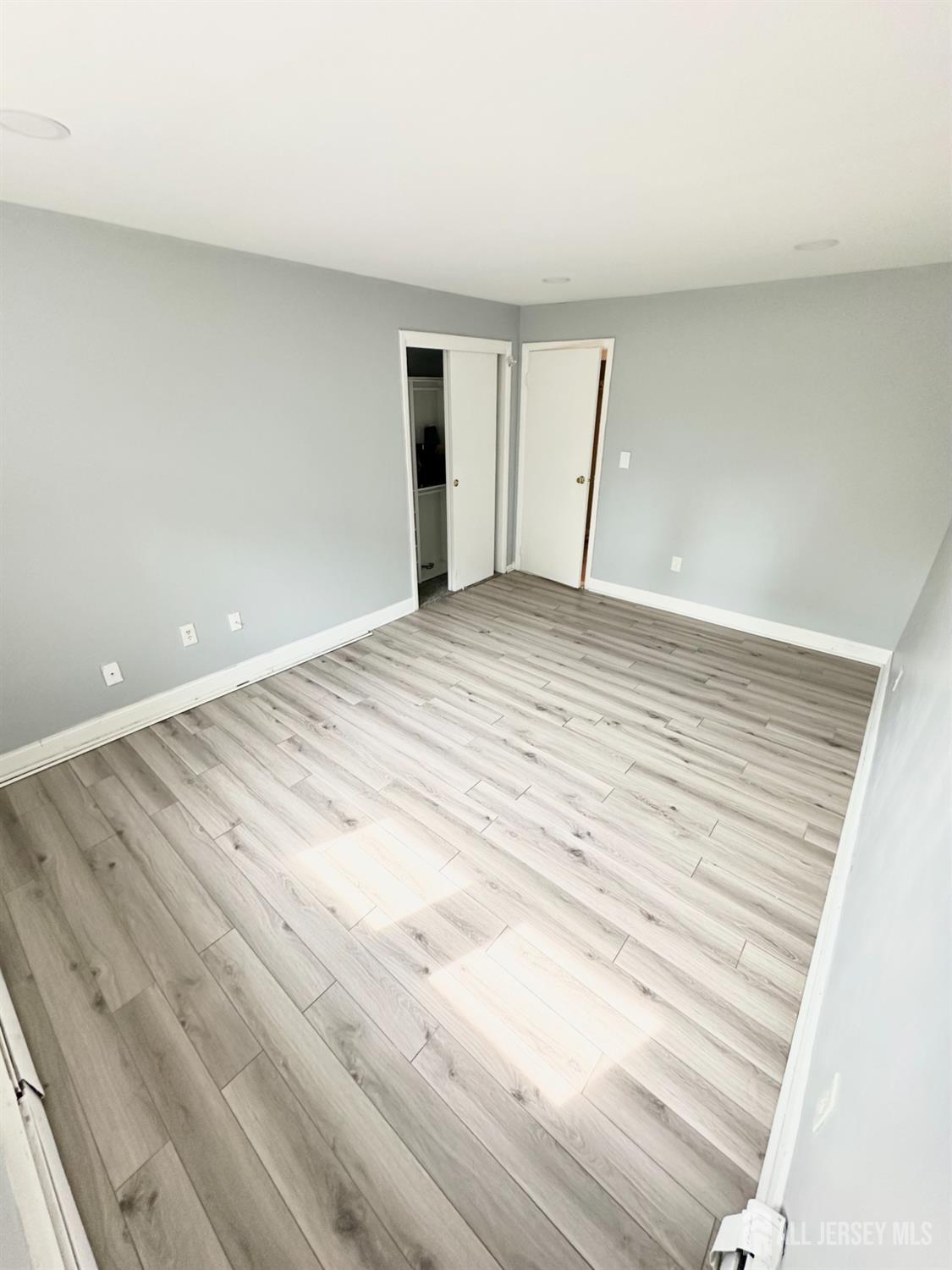 1604 74th Street, Unit B4 North Bergen, NJ 07047 - Photo 12 of 15 a view of empty room with wooden floor