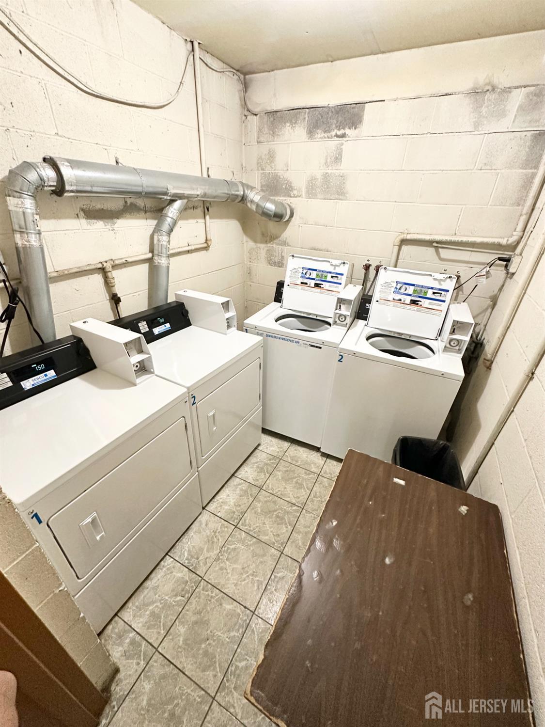 1604 74th Street, Unit B4 North Bergen, NJ 07047 - Photo 14 of 15 a utility room with dryer and washer