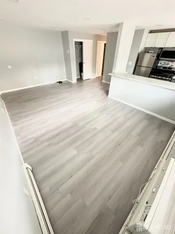 a view of a living room and entryway