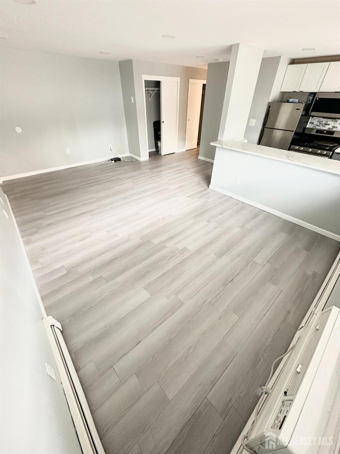 1604 74th Street, Unit B4 North Bergen, NJ 07047 - Photo 2 of 15 a view of a living room and entryway