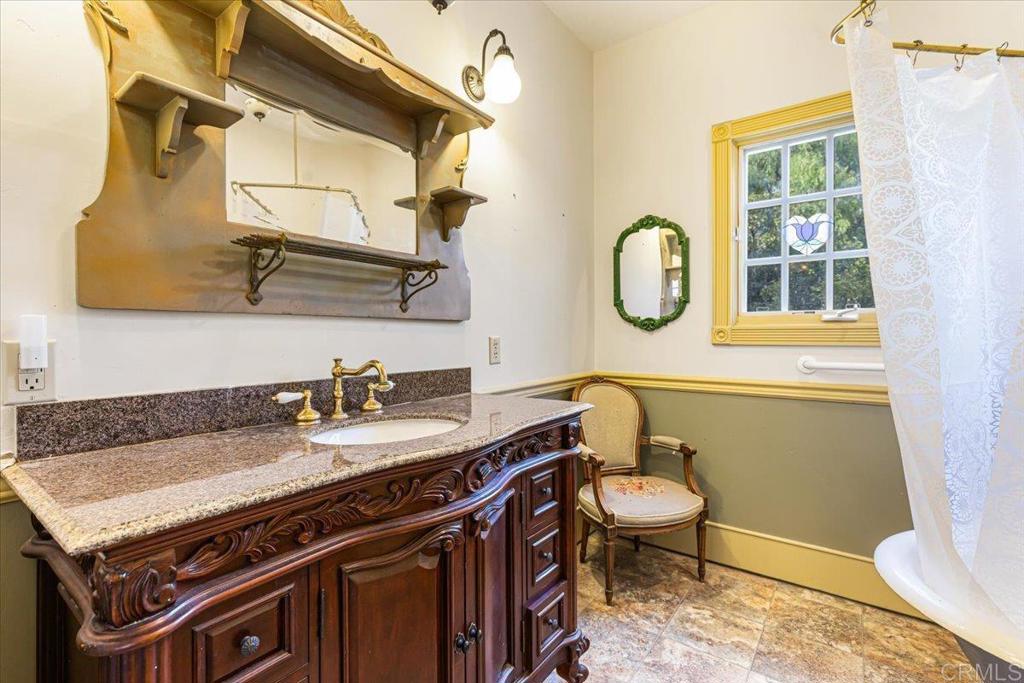 333 Salmon Road Ramona, CA 92065 - Photo 13 of 44 a bathroom with a granite countertop sink and a mirror