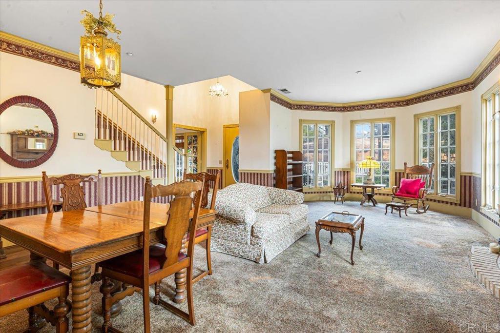 333 Salmon Road Ramona, CA 92065 - Photo 7 of 44 a dining room with furniture a chandelier and a rug