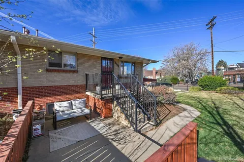 a view of a backyard with sitting area