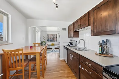 a kitchen with lots of counter top space and dining table