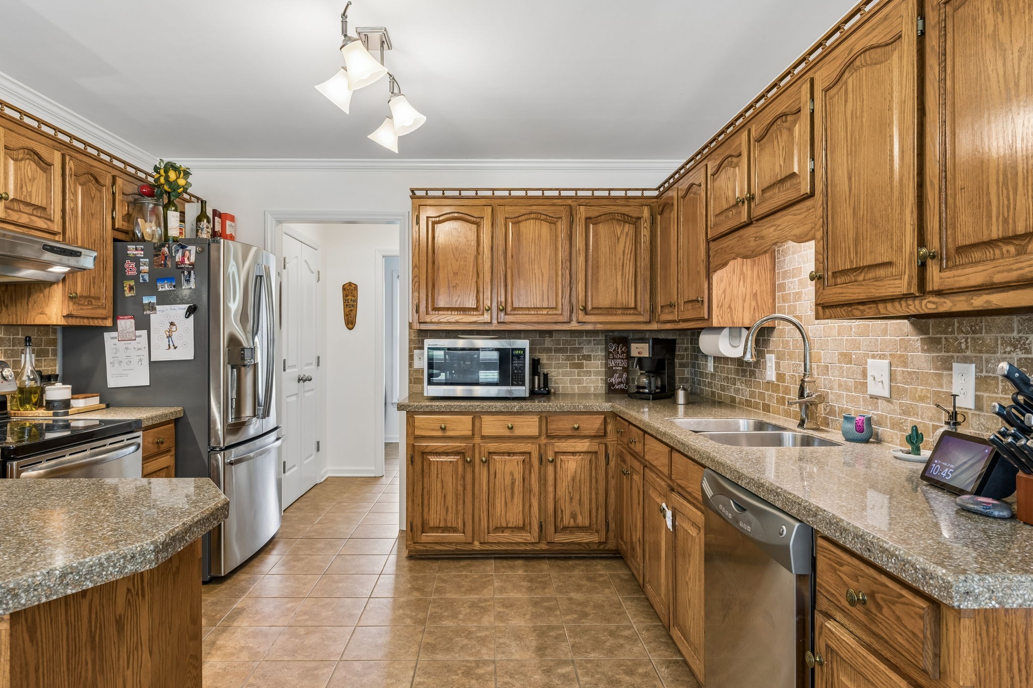 2104 Red Mile Road Murfreesboro, TN 37127 - Photo 12 of 28 a kitchen with stainless steel appliances granite countertop a sink stove and refrigerator