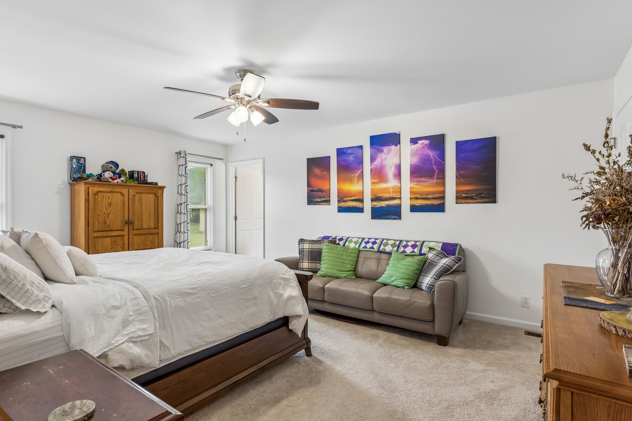 2104 Red Mile Road Murfreesboro, TN 37127 - Photo 15 of 28 a bedroom with a bed couch and a chandelier
