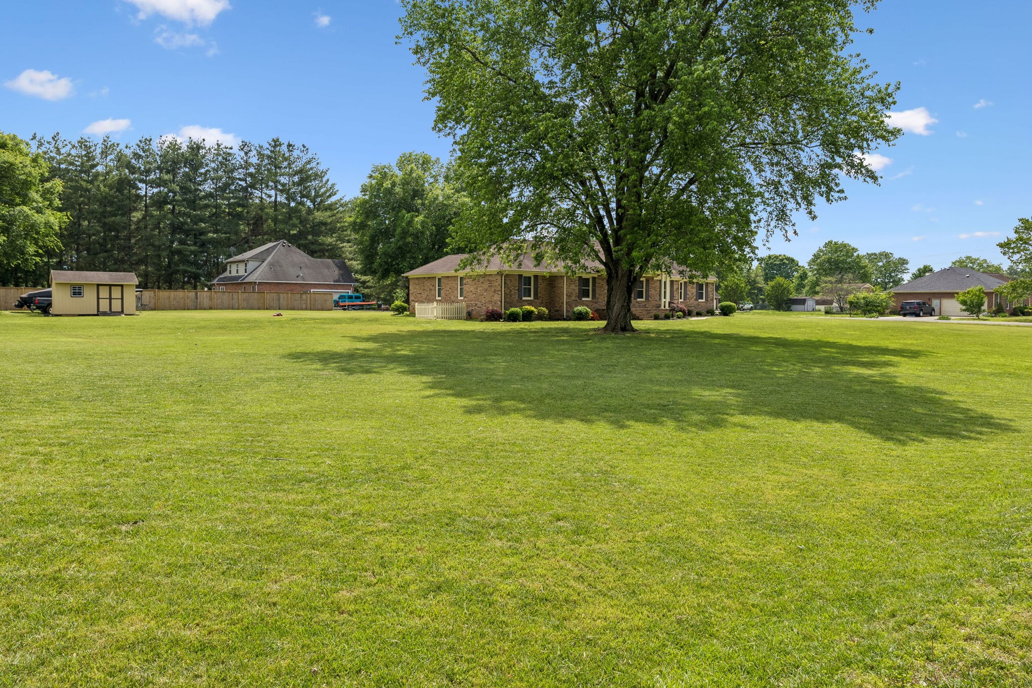 2104 Red Mile Road Murfreesboro, TN 37127 - Photo 24 of 28 a front view of a house with a yard and trees