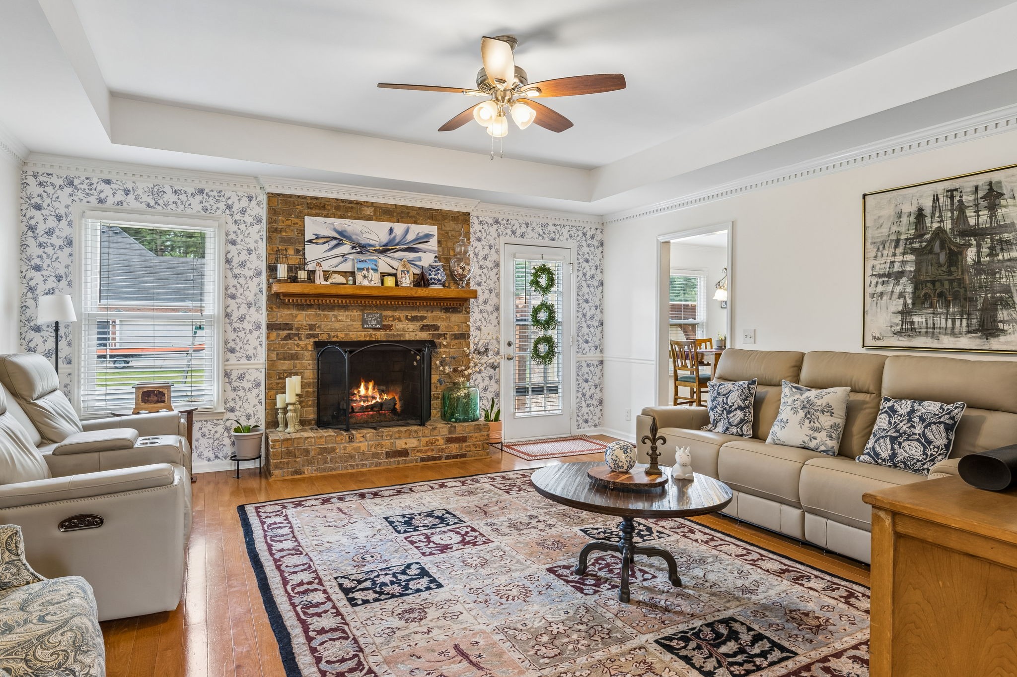 2104 Red Mile Road Murfreesboro, TN 37127 - Photo 8 of 28 a living room with furniture a rug and a fireplace