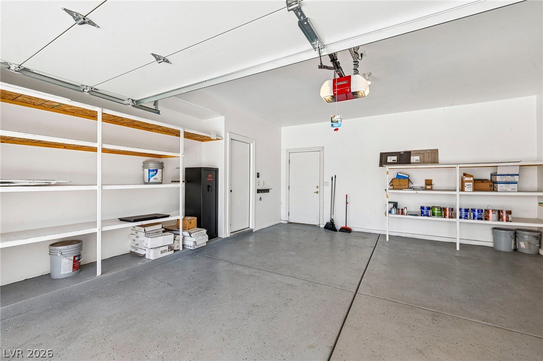 1176 Butternut Ranch Court Henderson, NV 89052 - Photo 42 of 60 A spotless garage offers abundant built-in storage shelves and an automatic door opener.