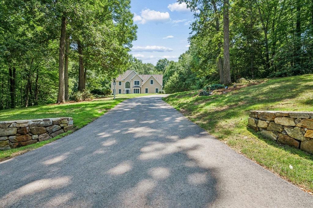 10 Burnett Road Southborough, MA 01772 - Photo 1 of 42 a view of a street with a yard and large trees