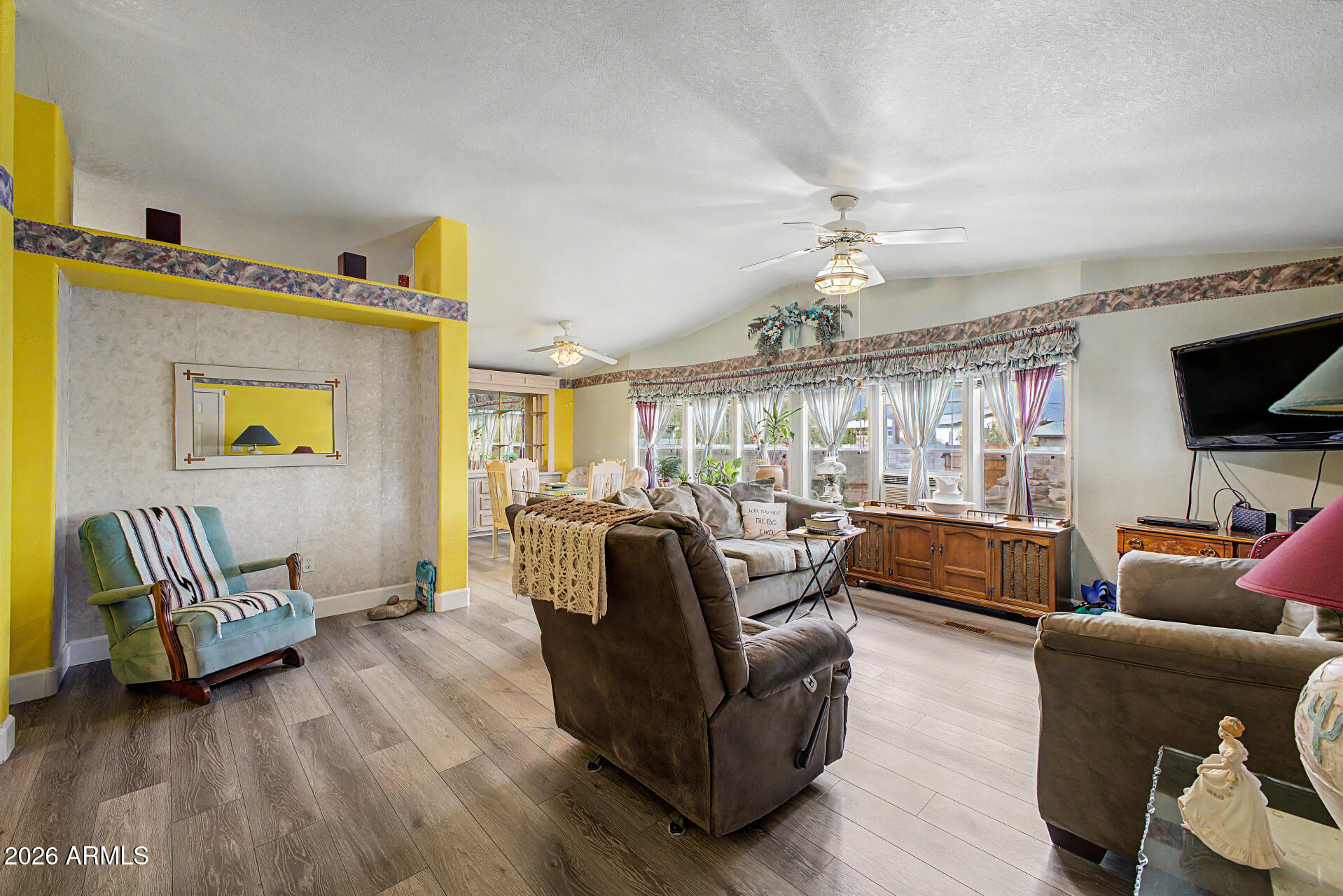 2548 South Val Vista Road Apache Junction, AZ 85119 - Photo 11 of 29 a living room with furniture and a flat screen tv