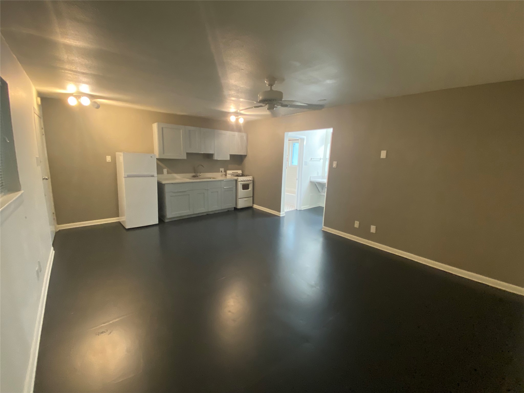 219 West Alabama Street, Unit 5 Houston, TX 77006 - Photo 2 of 10 a view of a kitchen with a sink and dishwasher
