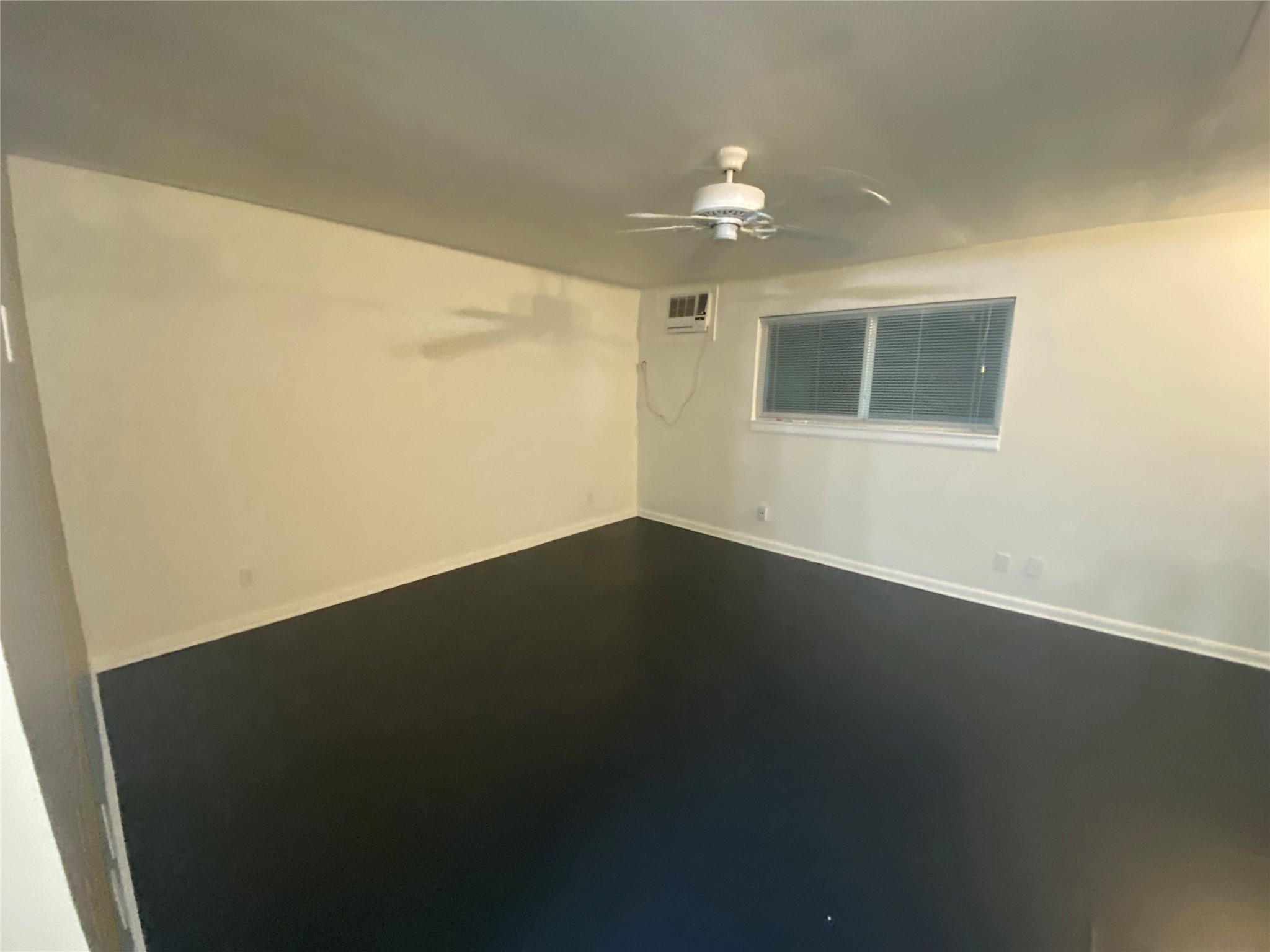 219 West Alabama Street, Unit 5 Houston, TX 77006 - Photo 10 of 10 a view of a livingroom with wooden floor and a ceiling fan