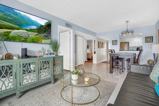 a bedroom with a bed and a tv