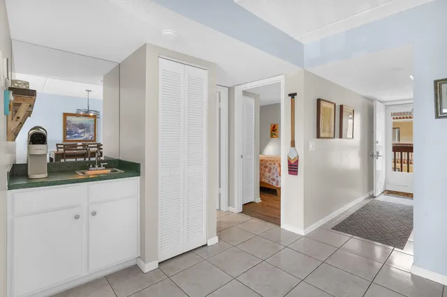 a living room with furniture a dining table and a piano