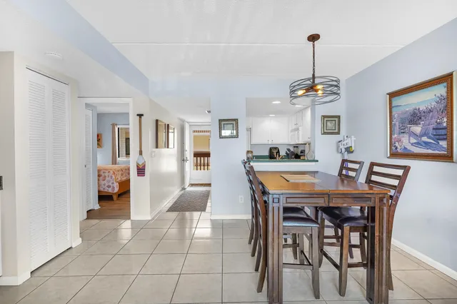 a view of a dining room with furniture wooden floor and a chandelier