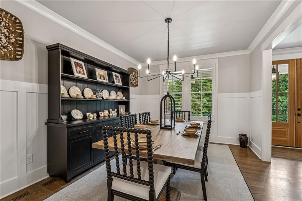 6326 Point Twenty Two Gainesville, GA 30506 - Photo 14 of 92 a view of a dining room with furniture window and wooden floor