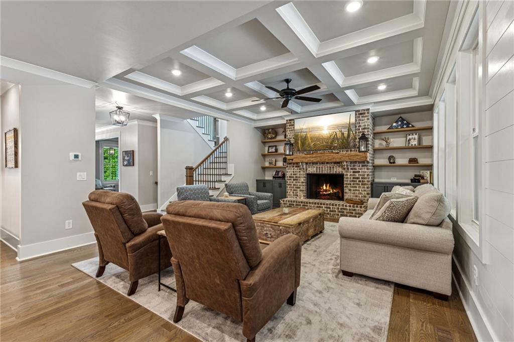 6326 Point Twenty Two Gainesville, GA 30506 - Photo 17 of 92 a living room with furniture a fireplace and a flat screen tv