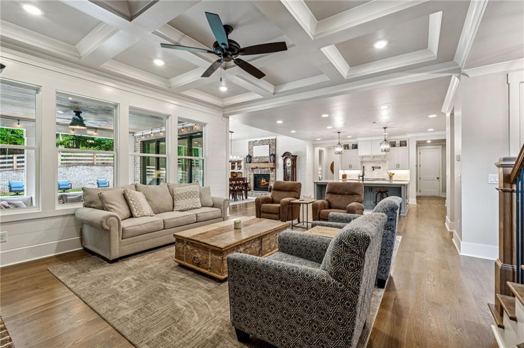 6326 Point Twenty Two Gainesville, GA 30506 - Photo 18 of 92 a living room with furniture a ceiling fan and a large window