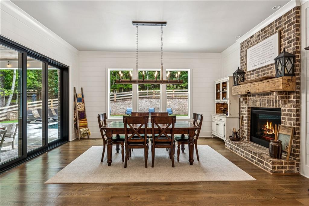 6326 Point Twenty Two Gainesville, GA 30506 - Photo 25 of 92 a view of a dining room with furniture window and wooden floor