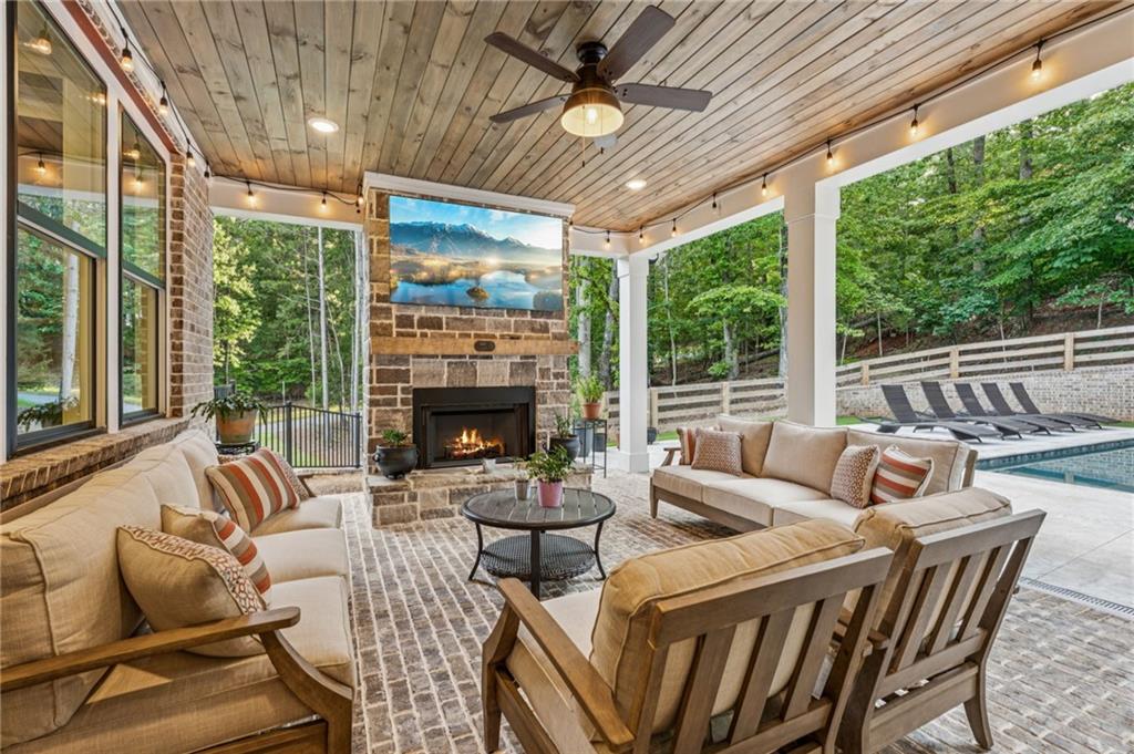 6326 Point Twenty Two Gainesville, GA 30506 - Photo 28 of 92 a outdoor space with patio couch and a fireplace