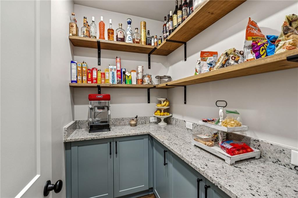 6326 Point Twenty Two Gainesville, GA 30506 - Photo 30 of 92 a kitchen with stainless steel appliances granite countertop a sink and cabinets