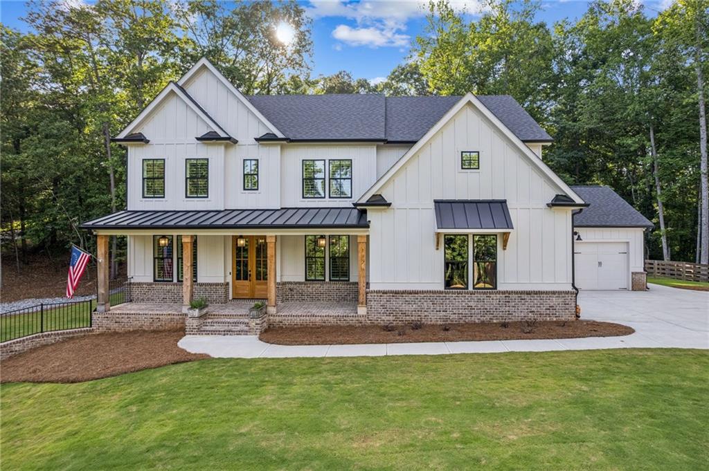 6326 Point Twenty Two Gainesville, GA 30506 - Photo 3 of 92 a front view of a house with a yard