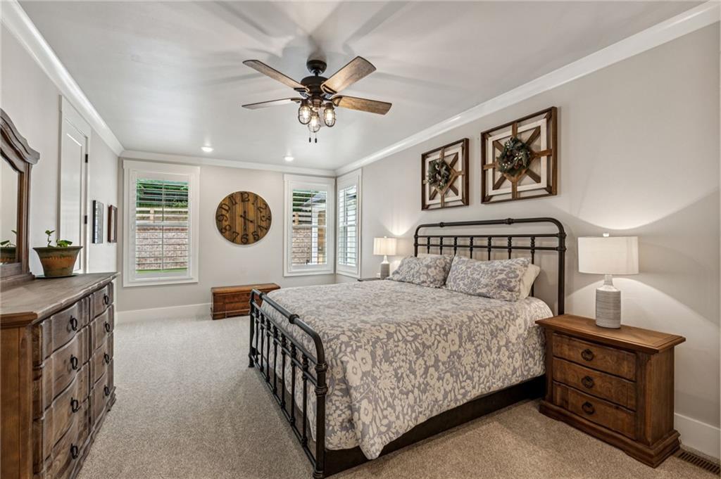 6326 Point Twenty Two Gainesville, GA 30506 - Photo 31 of 92 a bedroom with a bed and a chandelier